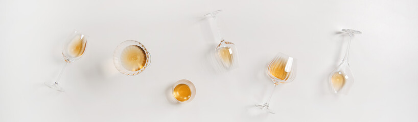 Trendy Orange or Amber wine in different glasses, wide composition