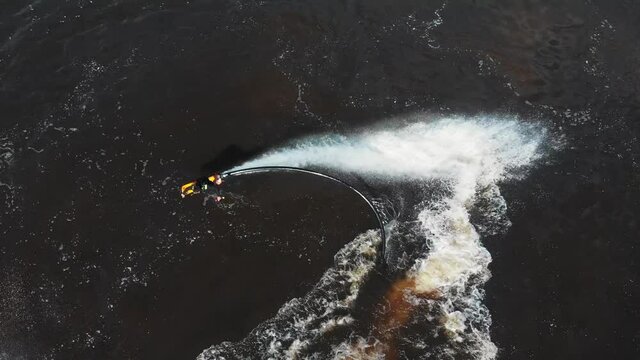 A man flying around over the water - aerial view