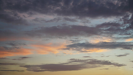 Dark, light clouds and blue sky at sunset