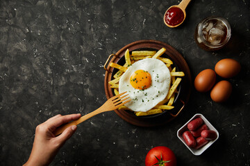 french fries with eggs on top
