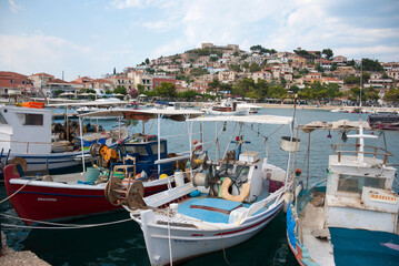 Astros Port, Peloponnese, Greece - June 24, 2021: Fishing boats at a picturesque fishing port.