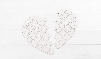 Bold heart shaped puzzle on white table