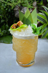 Fresh cocktail drink placed on blur tropical background. Summer