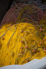 Astros Port, Peloponnese, Greece - June 24, 2021: Fishing nets drying at a picturesque fishing port.