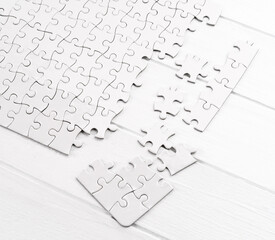 Matching pieces of empty puzzle on white background