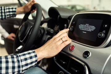 The man buys his first car.