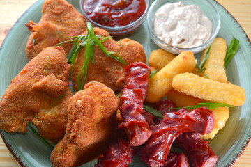 assorted beer snacks on wooden table pub menu concept