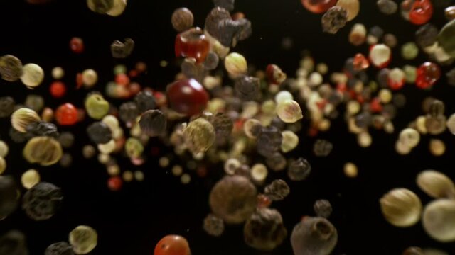 Super Slow Motion Detail Shot of Color Pepper Flying Towards Camera at 1000fps.