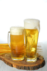 two Glasses of light beer with decorations and place for text