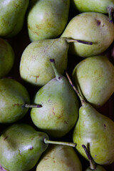 Image from above of a crate full of pears