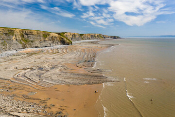 Aerial view of spectacular coastal limestone cliffs and ocean at Southerndown, Wales. UK