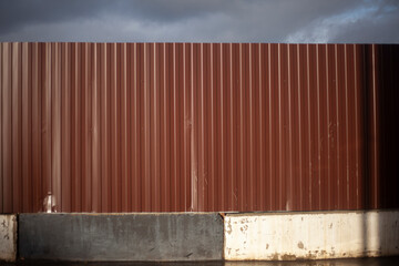 A metal fence. Brown fence.