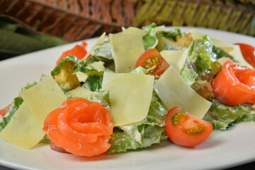 Fresh healthy salmon Classic Caesar salad on plate - Image