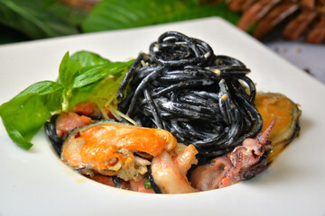 black noodles pasta with seafood closeup - Image