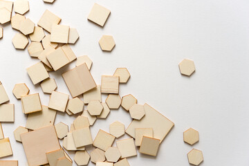 square and hexagonal wooden shapes on white