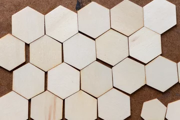 Tapeten pattern with wooden hexagons on an old art board © eugen
