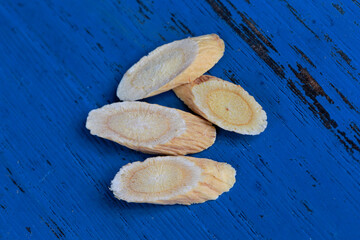 Chinese herbal medicine astragalus membranaceus on a white backg