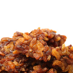 brown raisins on a white background