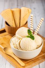 Bowl with vanilla ice cream balls.