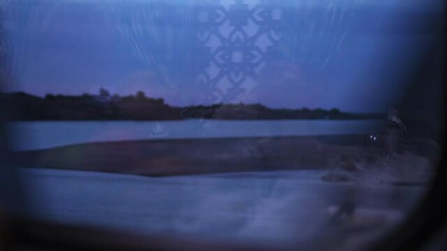 Close-Up Beautiful Shot Of River Seen Through Train Window During Evening - Ashgabat, Turkmenistan