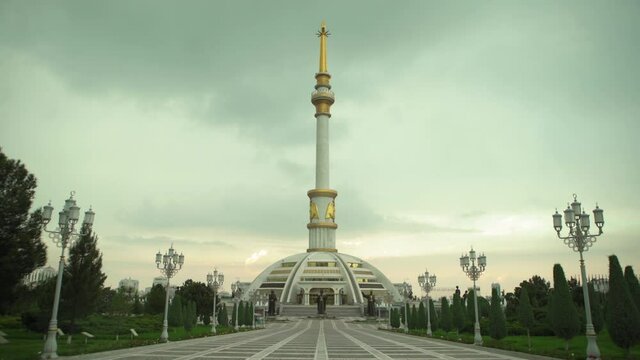 Lockdown Shot Of Independence Monument Against Cloudy Sky During Sunset - Ashgabat, Turkmenistan