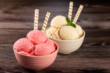 Bowls with strawberry and vanilla ice cream.