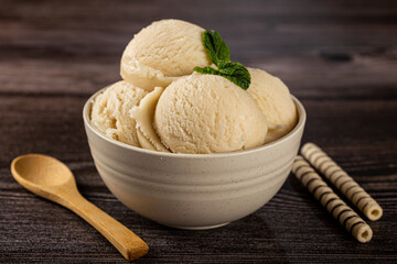 Bowl with vanilla ice cream balls.