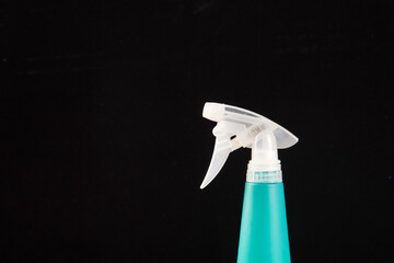 a spray bottle  on black background.