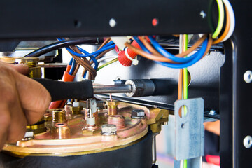 The master repairing broken coffee machine,disassembled coffee machine,Inside the coffee machine.