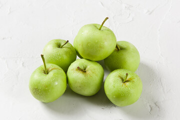 Ripe green apples on table