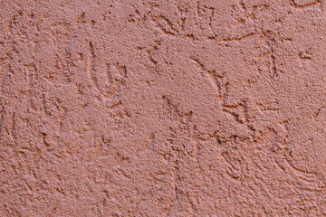 pared de cemento con un color pintado ladrillo, mostaza de fondo texturizado con lineas festuchado aspero.