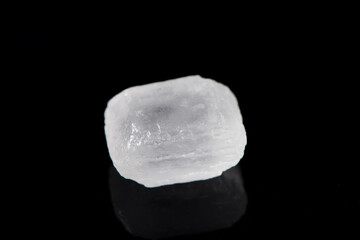 white rock candy sugar isolated on black background