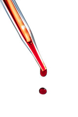 The hand holds a test tube with blood.