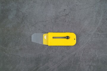 Yellow 35mm film picker isolated on grey background 