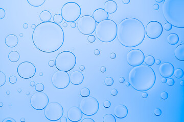Creative neon background with drops. Glowing abstract backdrop with vibrant gradients on bubbles. Blue overflowing color.