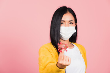 woman wear face mask protective holding DNA strand of Coronavirus