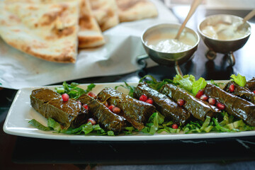 Plate of delicious vegetarian stuffed grape leaves, middle eastern food
