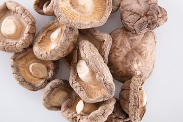Dried shiitake mushrooms on white background
