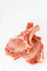 Raw pork chops bone in isoladet on white background.