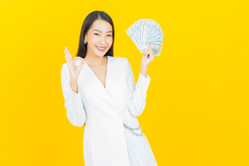Portrait beautiful young asian woman smile with a lot of cash and money