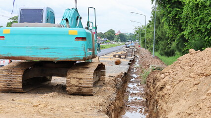 Drainage ditch on the side of the road. A longitudinal excavation ditch in a roadside sewer...