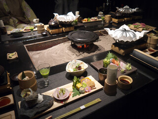 Japanese ryokan Fancy dinner served on the table with various gourmet kaiseki meals, traditional...