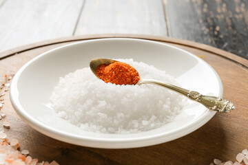 Different salt on wooden table, closeup