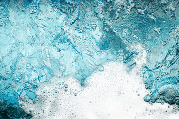 White foam clear blue water background closeup, sea or ocean foam wave border, froth bubbles...