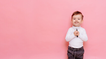 funny boy looking through magnifying glass with surprise