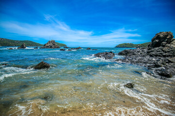 Beautiful beach at famous beach, rock, sun, water and island