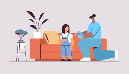 female doctor in mask vaccinating little child patient fight against coronavirus vaccine development concept