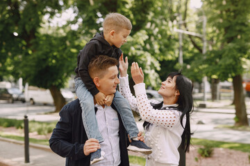 Cute family playing in a summer park