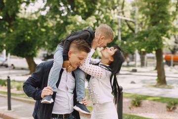 Cute family playing in a summer park