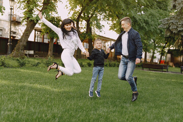 Fototapeta premium Cute family playing in a summer park